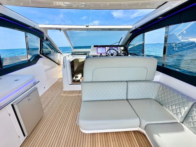 Slide: The Image of Interior of 2025 Schaefer 375 yacht with luxurious seating and ocean view. - 13
