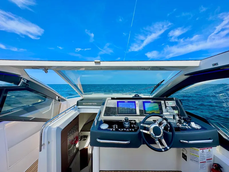 Slide: The Image of Modern Schaefer 375 yacht cockpit with advanced navigation systems, open sea view, 2025 model. - 14