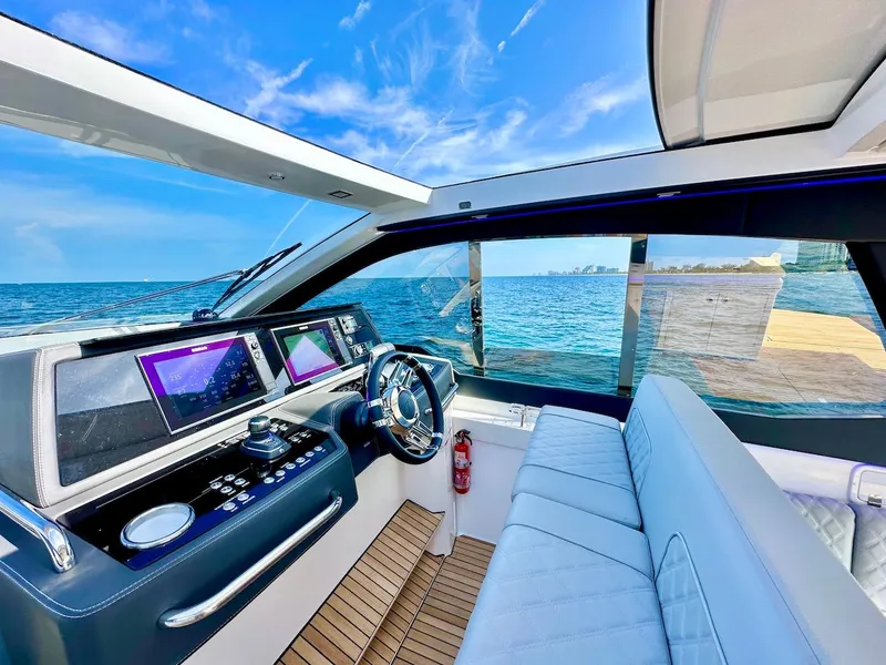 Slide: The Image of Modern Schaefer 375 yacht cockpit with advanced navigation systems, luxurious seating, and ocean view. - 15