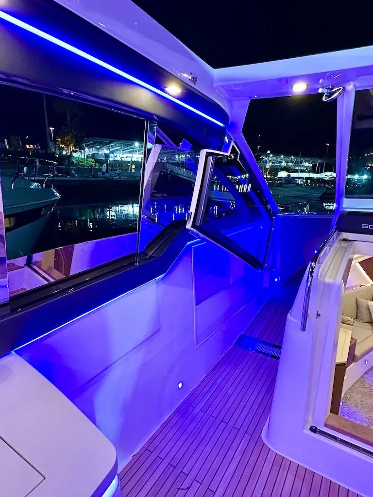 Slide: The Image of 2025 Schaefer 375 yacht interior with blue LED lighting at night. - 20