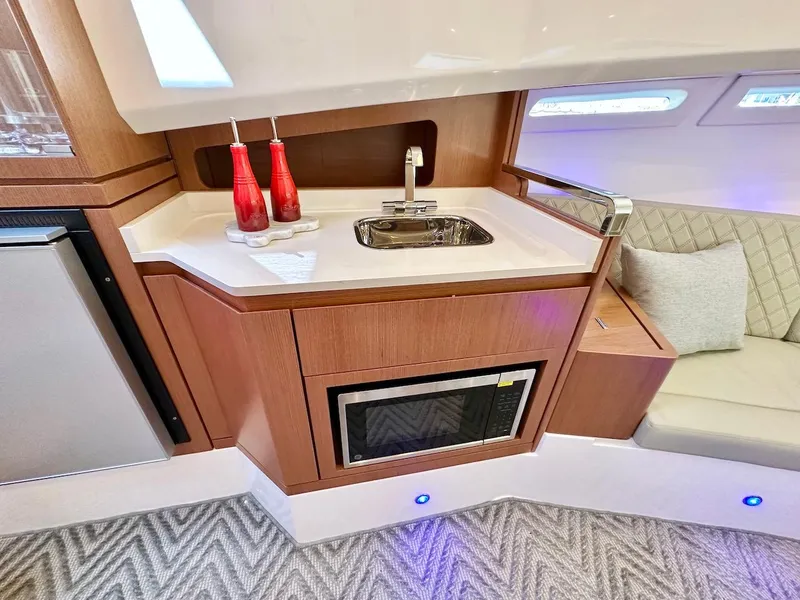 Slide: The Image of Modern kitchen area in 2025 Schaefer 375 yacht with sink, microwave, and mini-fridge. - 25