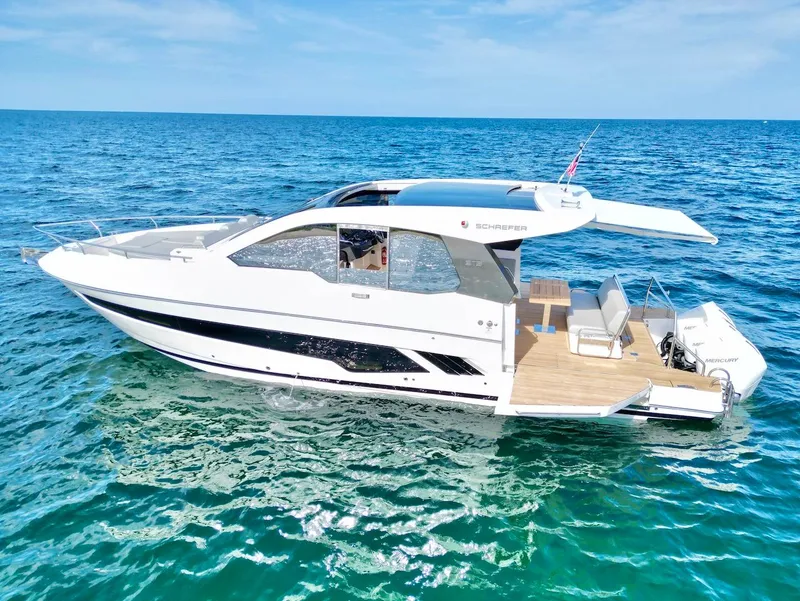 Slide: The Image of 2025 Schaefer 375 yacht cruising on clear blue ocean waters. - 3