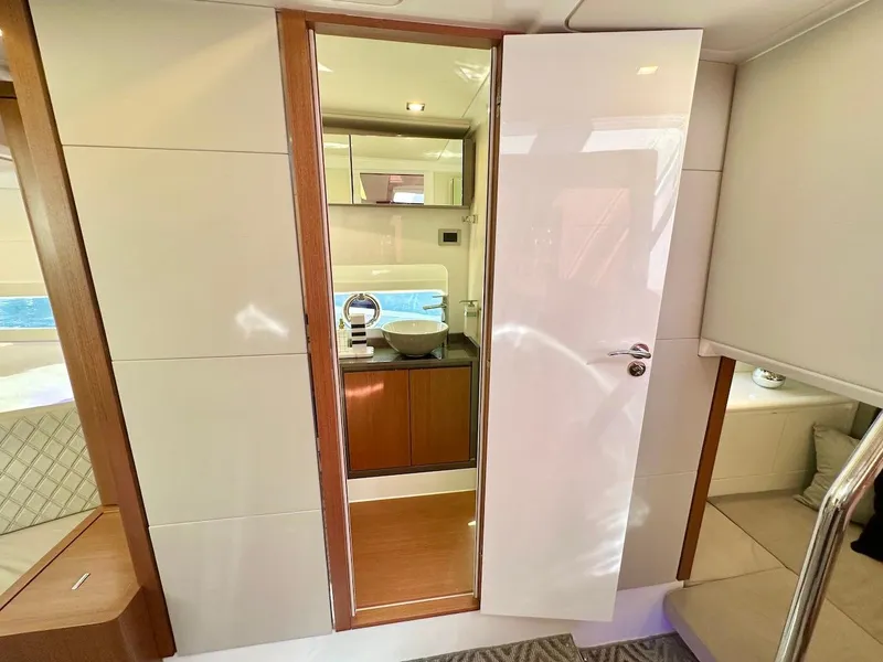 Slide: The Image of Interior of 2025 Schaefer 375 yacht showing bathroom and seating area. - 30