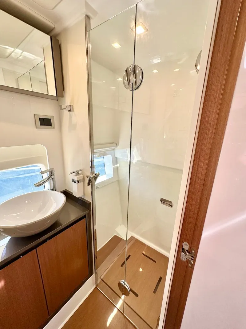Slide: The Image of Modern bathroom in 2025 Schaefer 375 yacht with glass shower and vessel sink. - 32