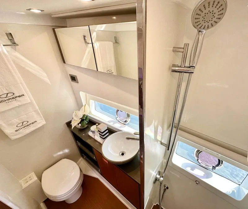Slide: The Image of Modern bathroom in Schaefer 375 yacht, featuring a sleek sink, toilet, and shower. - 33