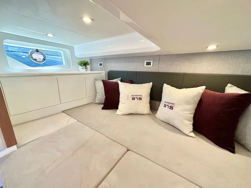Slide: The Image of Luxurious interior of 2025 Schaefer 375 yacht with plush seating and decorative pillows. - 34