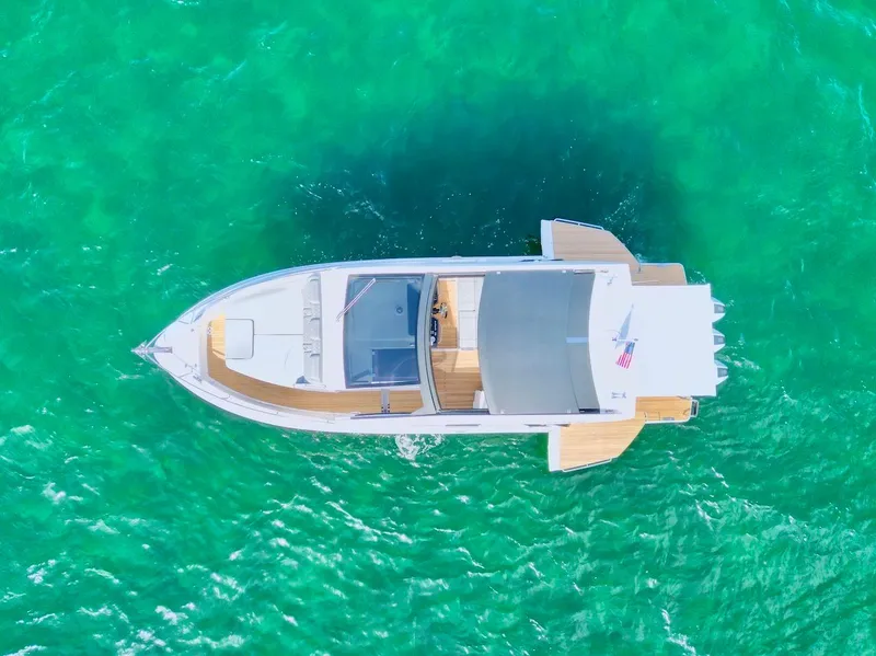 Slide: The Image of Aerial view of 2025 Schaefer 375 yacht on turquoise water. - 5