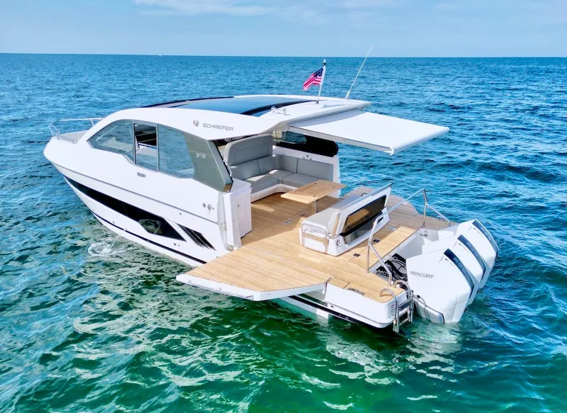 Slide: The Image of Luxury Schaefer 375 yacht, 2025 model, cruising on open sea with extended deck and seating area. - 6