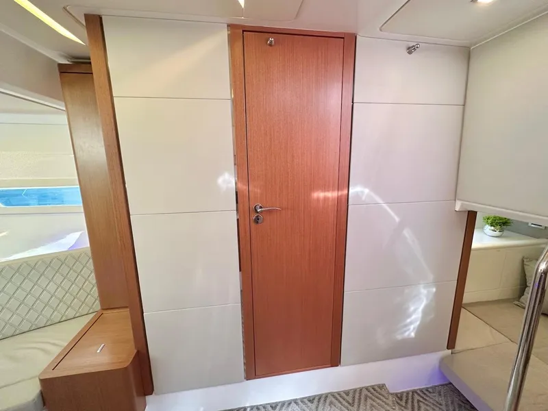 Slide: The Image of Interior of 2025 Schaefer 375 yacht with modern wooden door and sleek design. - 29