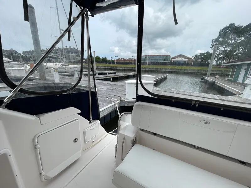 Slide: The Image of 2006 Regal 3060 Window Express boat interior at a marina dock. - 11