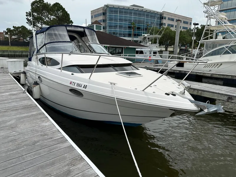 Slide: The Image of 2006 Regal 3060 Window Express boat docked at marina. - 3