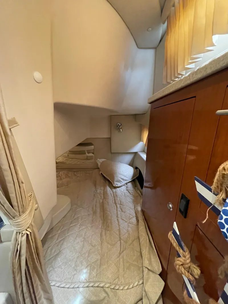 Slide: The Image of Interior cabin of a 2006 Regal 3060 Window Express boat with bed and storage. - 31