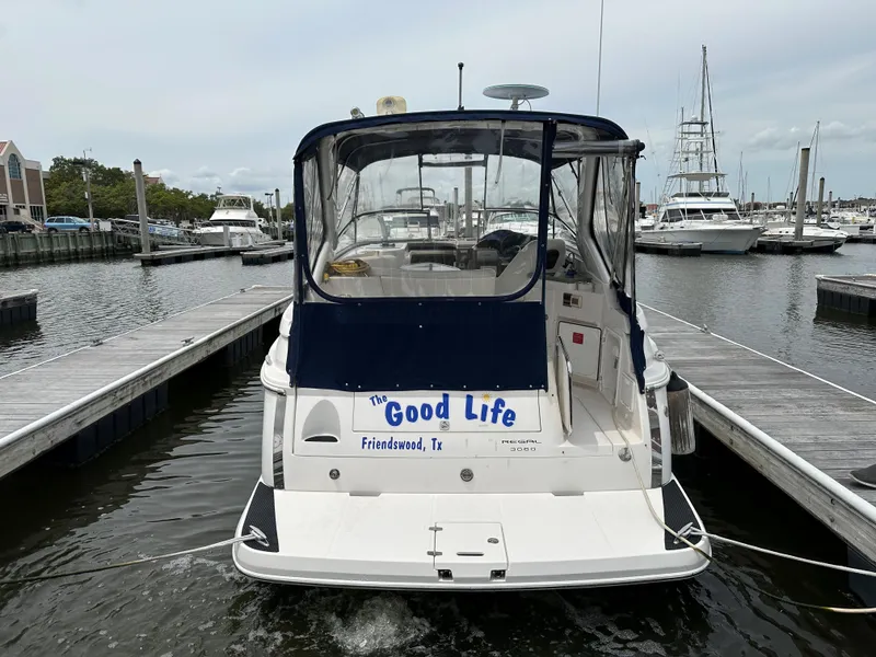 Slide: The Image of 2006 Regal 3060 Window Express boat docked at marina. - 6