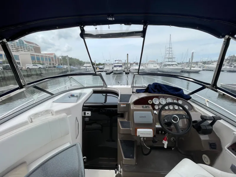 Slide: The Image of 2006 Regal 3060 Window Express boat interior at marina, view from helm. - 7