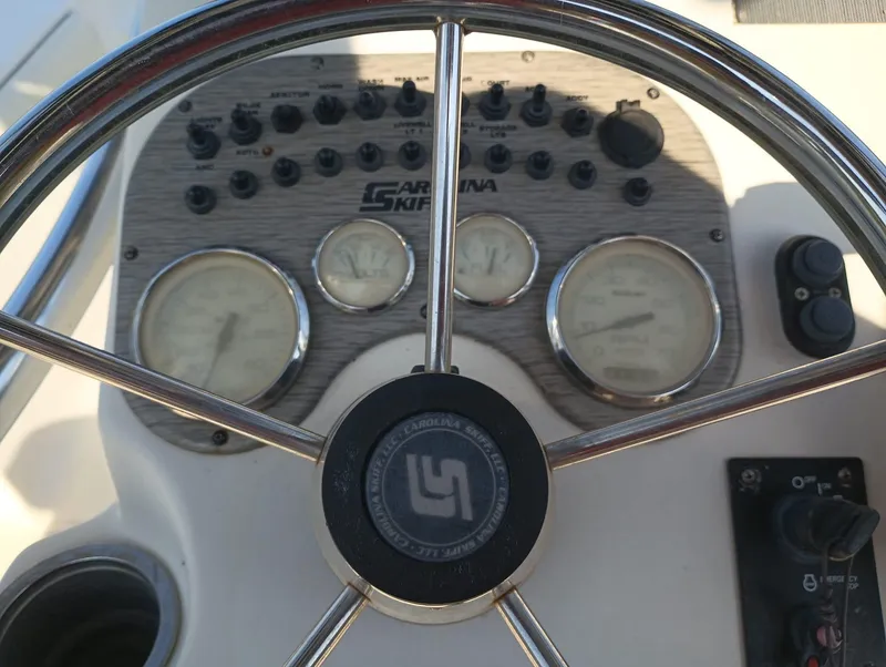 Slide: The Image of Close-up of 2014 Carolina Skiff Sea Skiff 21 dashboard and steering wheel. - 12