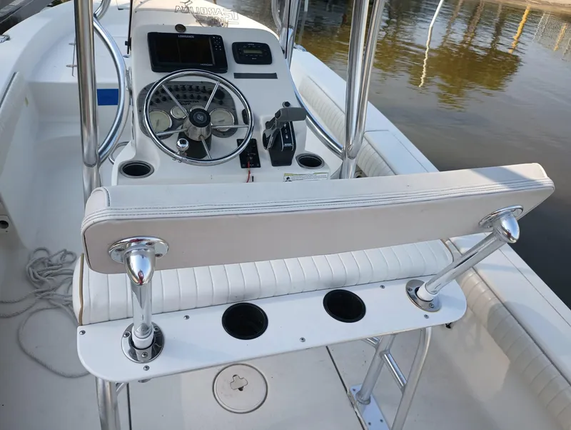 Slide: The Image of 2014 Carolina Skiff Sea Skiff 21 boat console and seating area. - 15