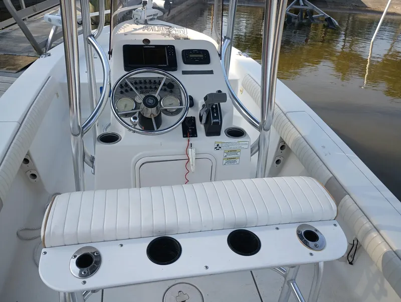 Slide: The Image of 2014 Carolina Skiff Sea Skiff 21 boat console with steering wheel and seating. - 16