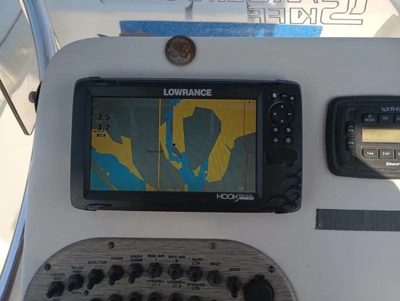 Slide: The Image of Lowrance Hook fish finder on 2014 Carolina Skiff Sea Skiff 21 dashboard. - 24