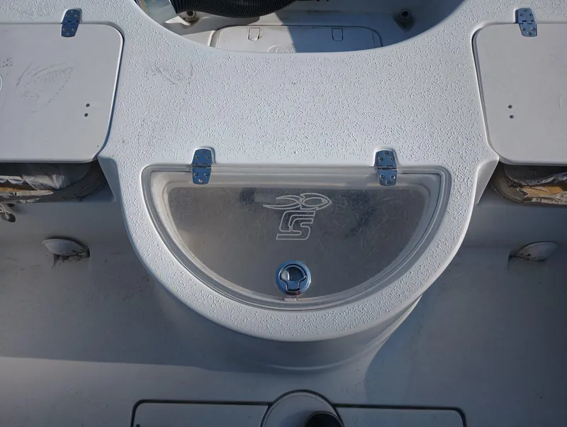 Slide: The Image of 2014 Carolina Skiff Sea Skiff 21 boat deck with storage compartments. - 27