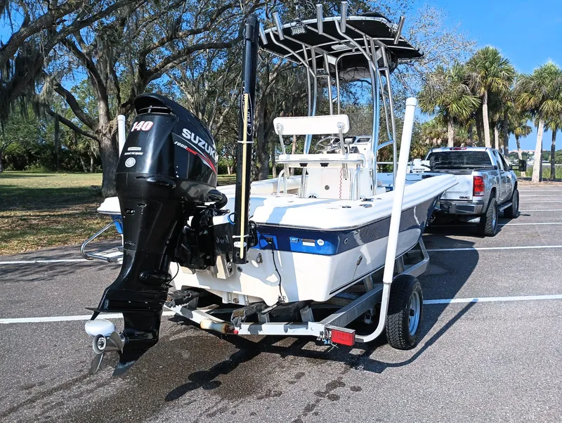 Slide: The Image of 2014 Carolina Skiff Sea Skiff 21 boat on trailer with Suzuki 140 outboard motor. - 28
