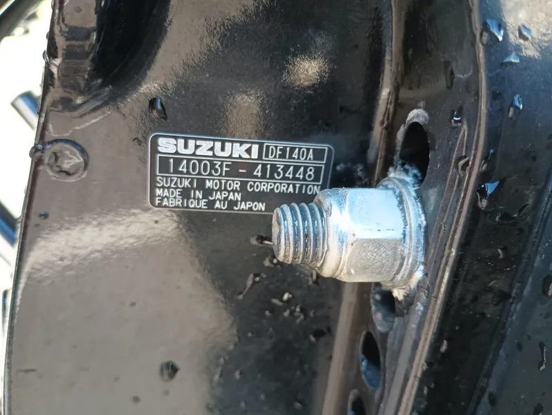Slide: The Image of Suzuki DF140A engine label on a 2014 Carolina Skiff Sea Skiff 21. - 29