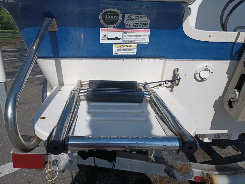 Slide: The Image of 2014 Carolina Skiff Sea Skiff 21 boat with a foldable swim ladder. - 31