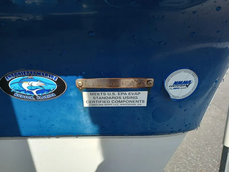 Slide: The Image of 2014 Carolina Skiff Sea Skiff 21 with EPA and NMMA certification stickers. - 33