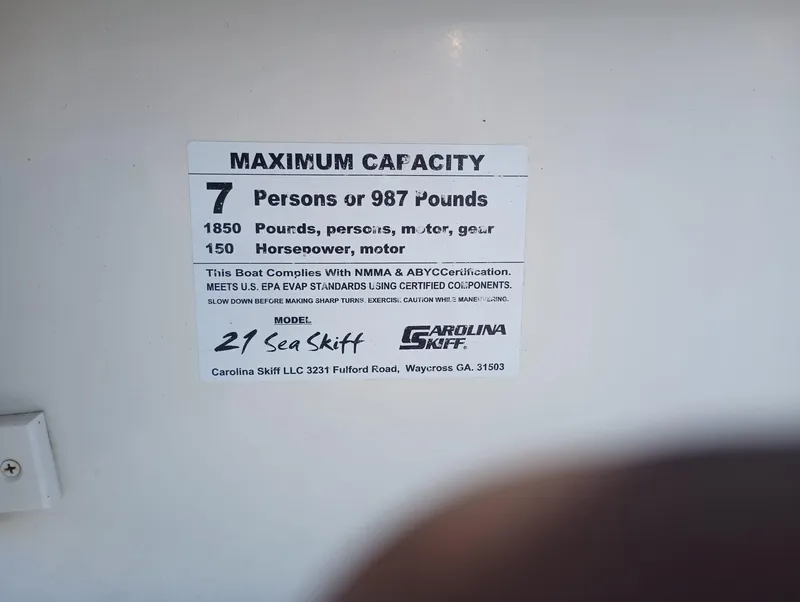 Slide: The Image of 2014 Carolina Skiff Sea Skiff 21 maximum capacity label, 7 persons or 987 pounds, 150 horsepower. - 39