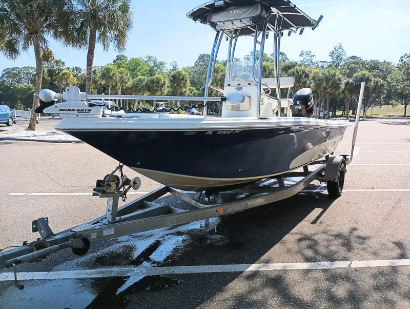 Slide: The Image of 2014 Carolina Skiff Sea Skiff 21 on a trailer in a parking lot. - 41