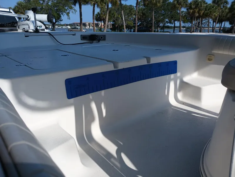 Slide: The Image of 2014 Carolina Skiff Sea Skiff 21 boat interior with blue measuring ruler. - 7