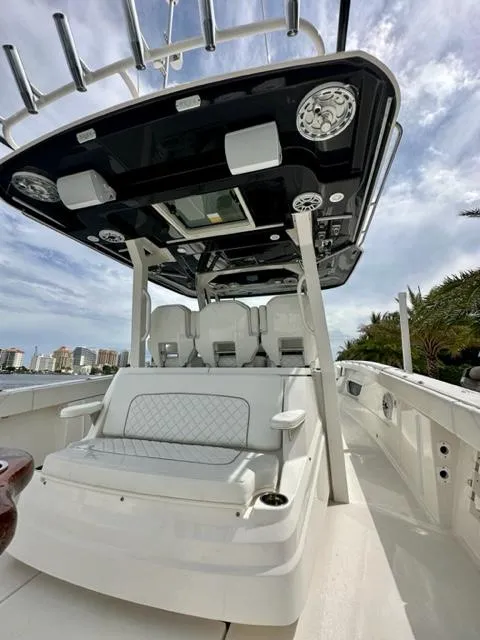 Slide: The Image of 2022 Pursuit S-378 Sport boat with seating and overhead console. - 10