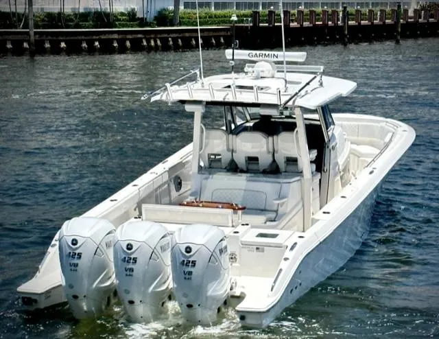 Slide: The Image of 2022 Pursuit S-378 Sport boat with triple Yamaha 425 engines on water. - 2