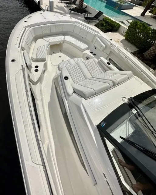 Slide: The Image of 2022 Pursuit S-378 Sport boat with luxurious seating and sleek design. - 6