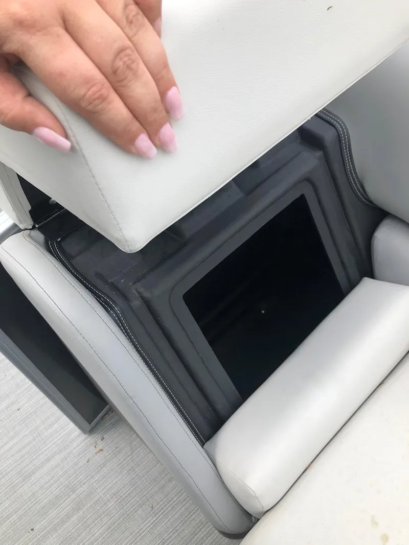 Slide: The Image of 2023 Lowe 250 boat seat storage compartment being opened. - 10