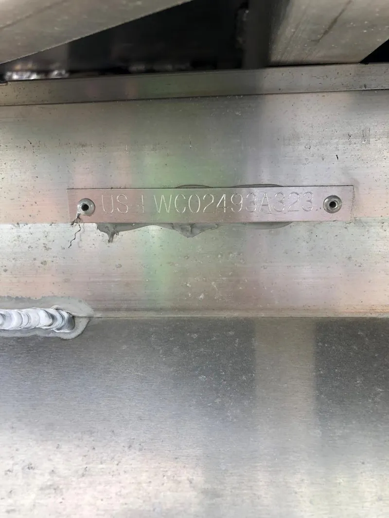 Slide: The Image of 2023 Lowe 250 boat hull identification number plate. - 13