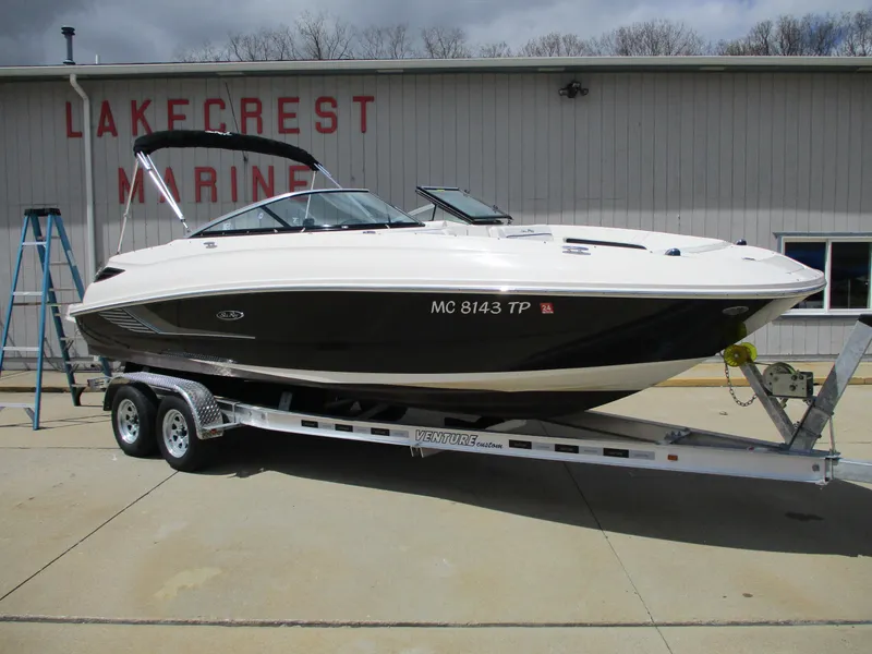 Slide: The Image of 2015 Sea Ray 240 Sundeck boat on trailer at Lakecrest Marine. - 2