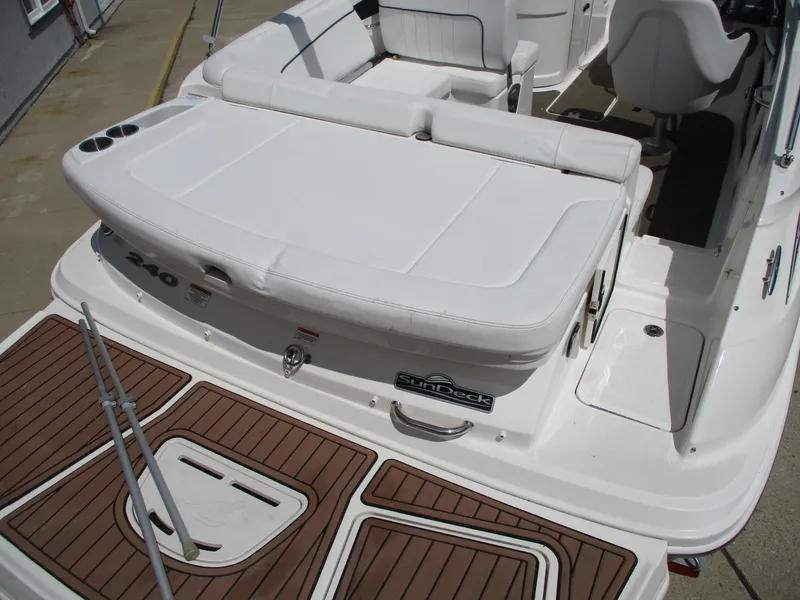 Slide: The Image of 2015 Sea Ray 240 Sundeck boat with white seating and teak-style deck. - 6