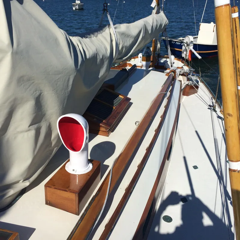 Slide: The Image of 1958 Sparkman & Stephens Nevins 40 sailboat deck with wooden accents and rigging. - 10