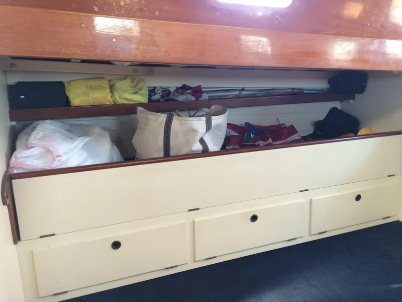 Slide: The Image of 1958 Sparkman & Stephens Nevins 40 sailboat deck with wooden details and red vents. - 13