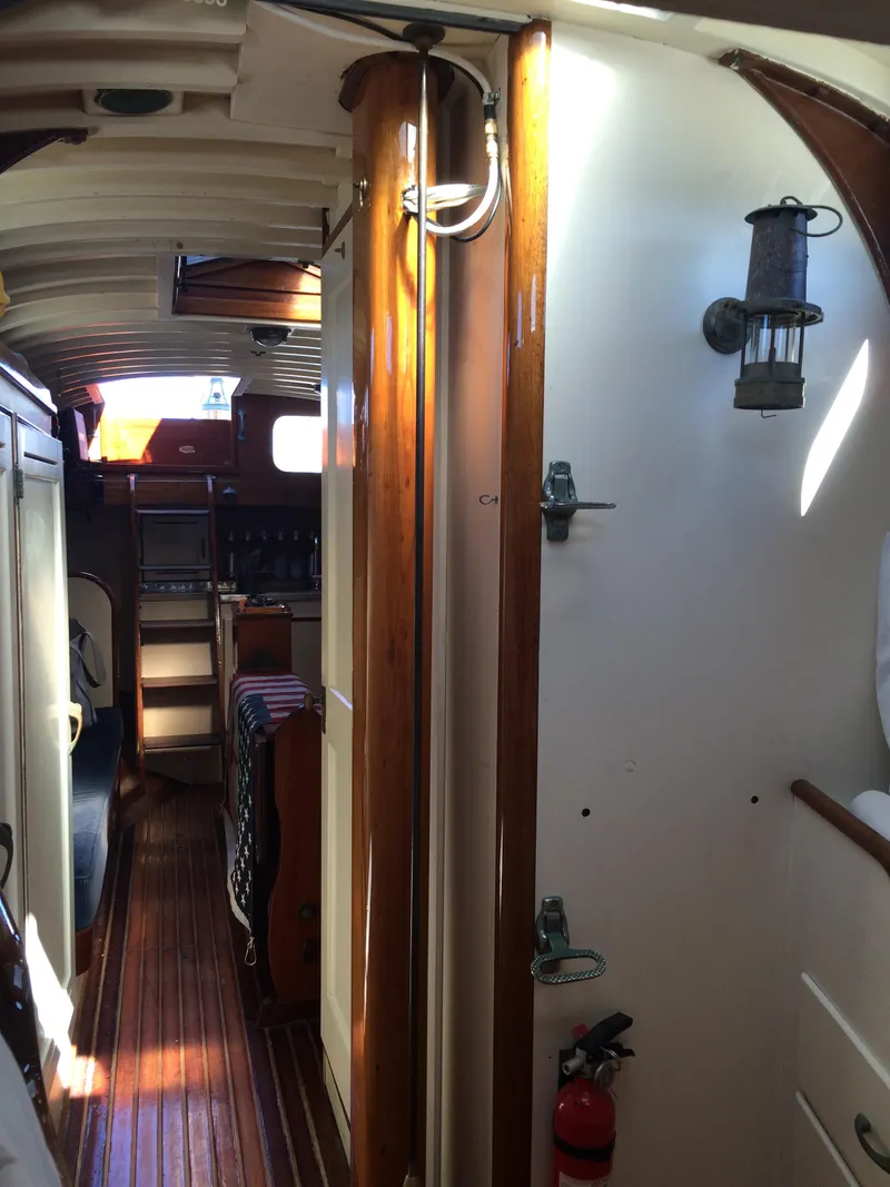 Slide: The Image of 1958 Sparkman & Stephens Nevins 40 sailboat deck with wooden details and covered sails. - 14