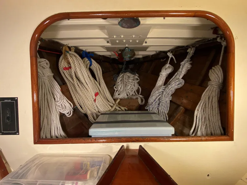 Slide: The Image of 1958 Sparkman & Stephens Nevins 40 yacht interior with wooden finishes and blue seating. - 16