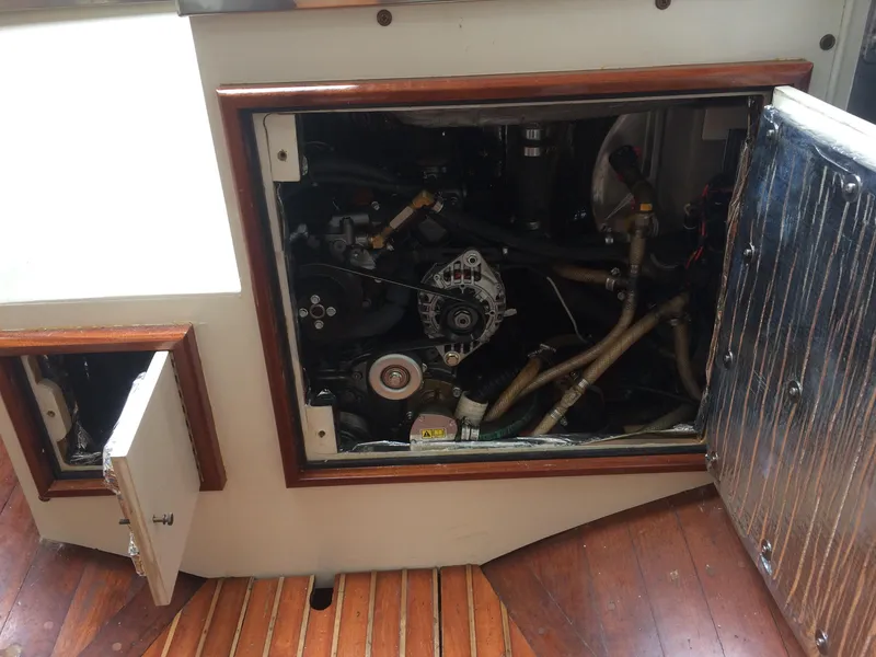 Slide: The Image of Interior of 1958 Sparkman & Stephens Nevins 40 yacht, featuring cozy wooden bunks and nautical decor. - 17