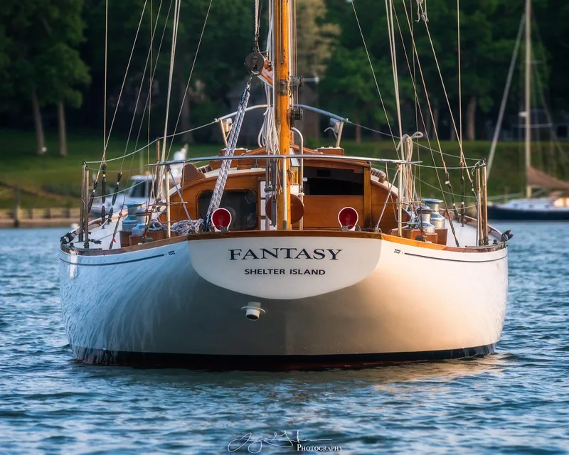 Slide: The Image of Sailing yacht Sparkman & Stephens Nevins 40, 1958, gliding on open water under clear skies. - 5