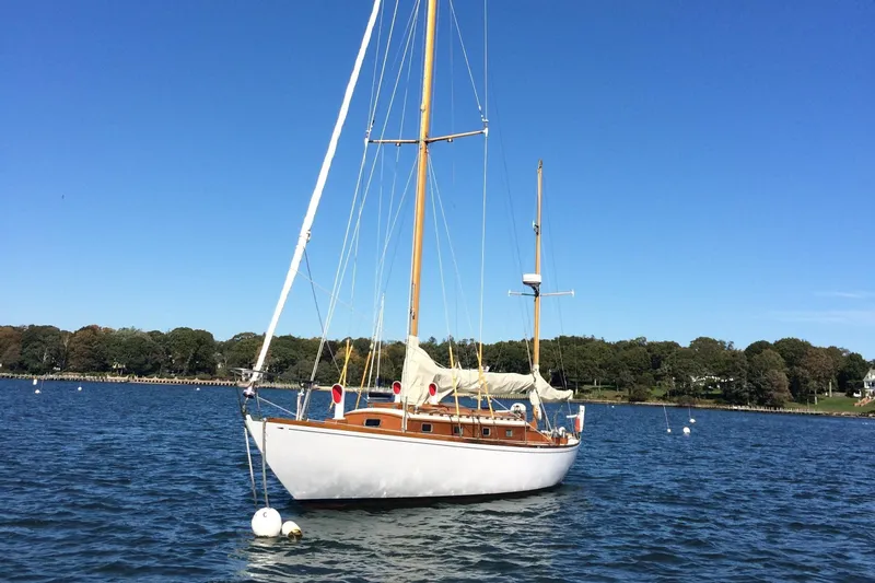 Slide: The Image of 1958 Sparkman & Stephens Nevins 40 sailboat cruising on open water. - 6