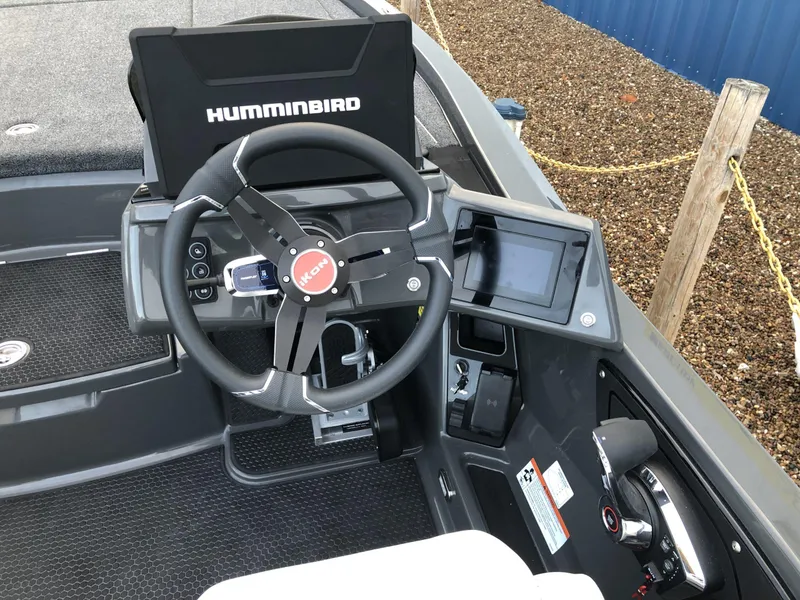 Slide: The Image of 2024 iKon LX20 boat dashboard with Humminbird electronics and steering wheel. - 12