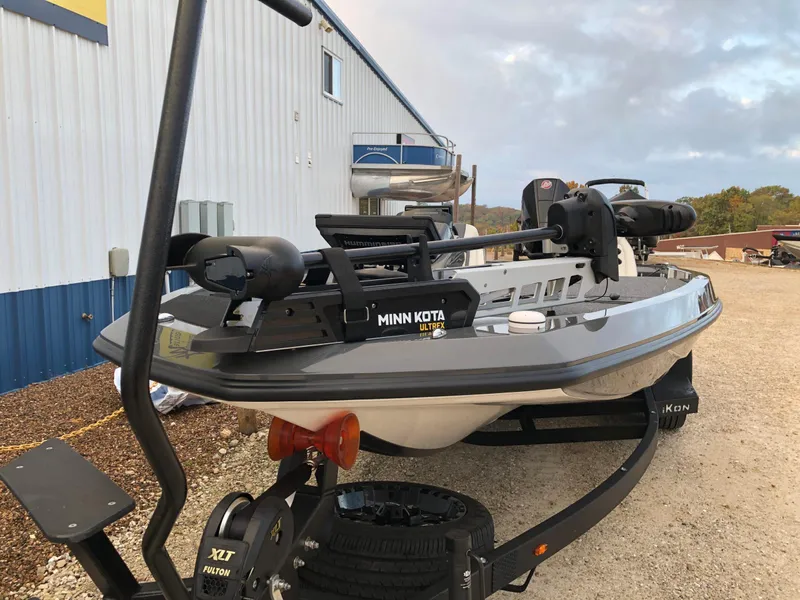 Slide: The Image of 2024 iKon LX20 boat with Minn Kota trolling motor on trailer. - 2