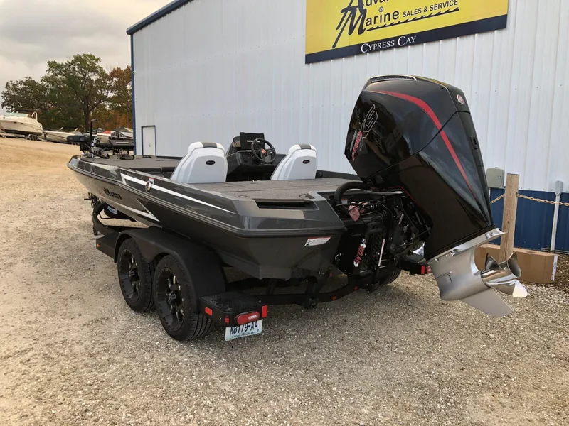 Slide: The Image of 2024 iKon LX20 boat on trailer at marine sales and service center. - 4