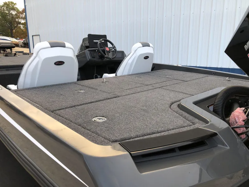 Slide: The Image of 2024 iKon LX20 boat interior with dual seats and spacious deck. - 5