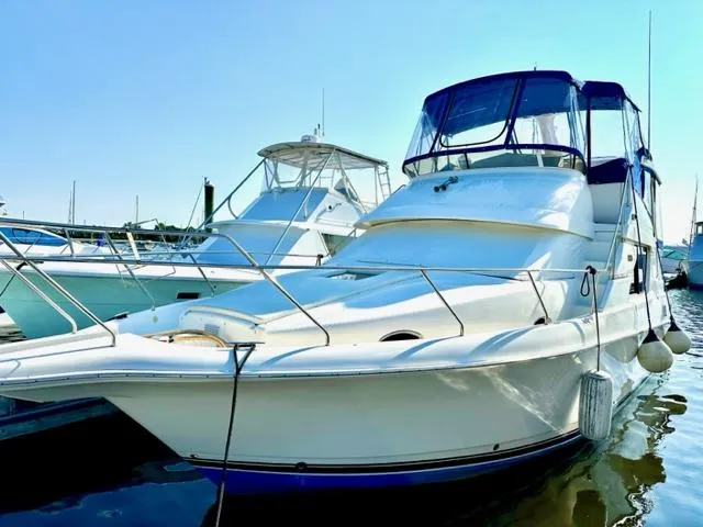 Slide: The Image of 2000 Silverton 392 Motor Yacht docked at marina. - 0