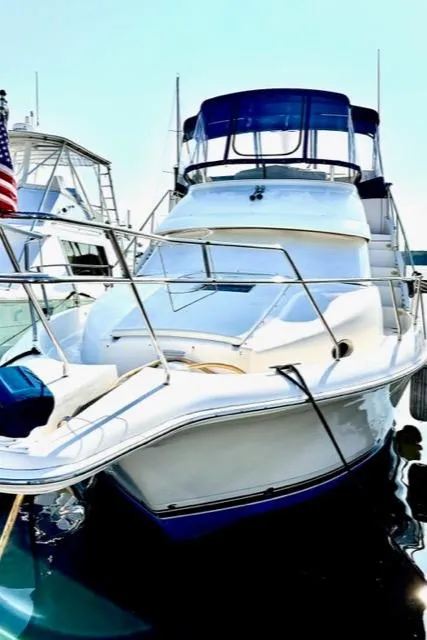 Slide: The Image of 2000 Silverton 392 Motor Yacht docked at marina. - 1